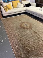 Full view of carpet under sectional sofa