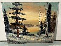 Front view of the full oil painting showing the lakeside landscape with trees, water, and distant hills under a warm sky.