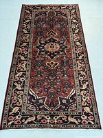 Full view of the Persian Zanjan wool rug showing overall pattern and border design.