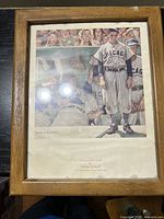 Framed print showing the artwork depicting Chicago baseball players and a coach, with signatures and print number visible.