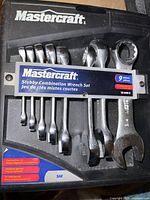 Mastercraft stubby combination wrench set in black plastic case showing nine wrenches from 1/4 to 3/4 inch sizes, missing 9/16 inch wrench.