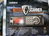 Front of the box showing Uniden BCT15X scanner digital display and control layout, branding and BearTracker warning system logo