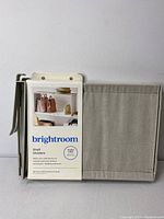 Front view of Brightroom shelf dividers in packaging showing fabric divider and product label with brand and usage image