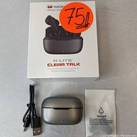 Box front showing Monster N-Lite Clear Talk branding and image of earbuds with charging case, along with a large orange price sticker.