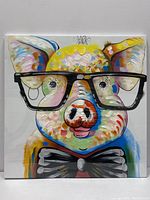 Front view of the colorful pig painting showing details of the pig's face, oversized glasses, and bow tie.