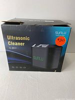 Closed retail box of the Sunu Ultrasonic Cleaner SL-UC01 showing product image and branding.