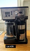 Hamilton Beach FlexBrew coffee maker showing front view with glass carafe and single-serve side compartment