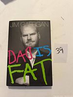Book cover showing Jim Gaffigan with the title 'Dad Is Fat' in colorful letters