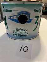 Front of the bird house showing circular entrance and the Confederation Bridge graphic on license plate