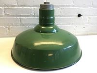 Full view of the green enamel lamp shade showing overall shape and glossy finish.