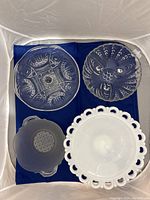 Top-down photo of all four glassware items arranged on fabric background showing details and condition.