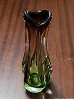 Front side view of the purple and green glass vase showing the organic shape and color gradient