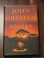 Front cover of the hardcover book 'Sooley' by John Grisham showing artwork of basketball and sunset.