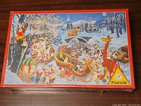Photo of front box showing one colorful Christmas puzzle art with elves, reindeer, and snowy winter scene