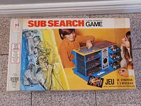 Front view of the Milton Bradley Sub Search 3 Level Strategy Game box showing colorful vintage design and children playing game.