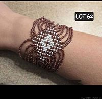 Hand-beaded bracelet worn on wrist showing design and fit.