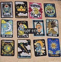 Top view of 12 embroidered celestial tarot card style patches showing variety of celestial and tarot imagery.