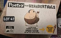 Poetry for Neanderthals game box with caveman illustration and branding