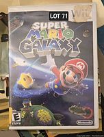 Front cover of Super Mario Galaxy game case for Wii showing colorful artwork featuring Mario and space elements.