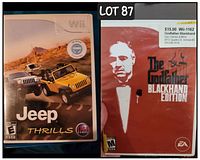 Two Wii game cases, Jeep Thrills and The Godfather Blackhand Edition, placed side by side.