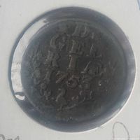 Photo of obverse side of 1753 Gelderland coin showing date and inscriptions with aged patina.