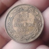 Reverse side of the 1911 Canadian large cent coin showing 'ONE CENT CANADA 1911' with maple leaf wreath design.