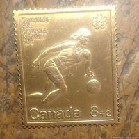 Front of bronze bar showing basketball player design and text indicating 1976 Montreal Olympics and Canada 8+2