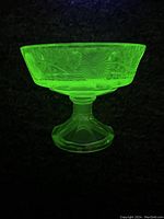 Photo under UV showing bright green fluorescence of etched coupe bowl