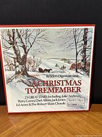 Front cover of the gatefold album showing winter landscape artwork with snow, trees, and a horse-drawn sleigh. Title 'A Christmas To Remember' and Reader's Digest branding.