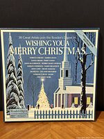 Front of the box set with Christmas scene and title 'Wishing You A Merry Christmas'