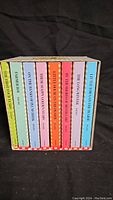 Eight books from the Little House on the Prairie series show spines with titles in very good condition.