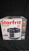Photo shows front of the Starfrit electric pressure cooker box with product image and features.