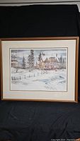 Full view of framed print showing the winter Victorian house scene.