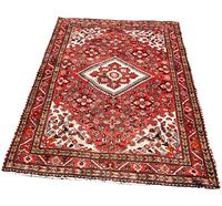 Full view of low-pile Persian rug with red and cream geometric floral motifs and central diamond medallion