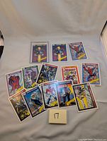 Set of 13 Marvel trading cards from 1990, featuring superheroes and villains, with a note marked '17' in front.