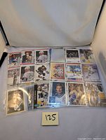 Overview photo showing 18 Wayne Gretzky cards laid out in two rows inside plastic sleeves.