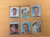 Six baseball cards spread out to show full front images, featuring players Ken Johnson, Stacy Stallard, Ernie Bowman, Gary Bell, Ted Abernathy, and Smoky Burgess.