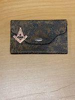 Antique pigskin jewelry snap case with Masonic compass fob on top
