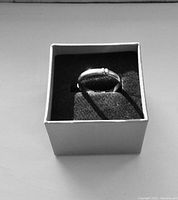 Ring displayed in black foam inside presentation box