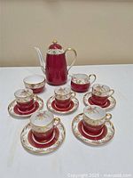 Full set of Spode Oakleaf pattern coffee items including pot, cups, saucers, creamer and sugar bowl arranged on table