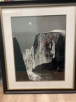 Front view of the framed lithograph showing Half Dome and moon in black and white.