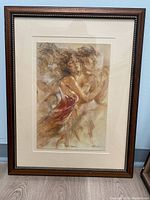 Full image of the framed artwork showing two women with flowing hair in an ethereal style with warm tones.