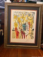 Front view of framed print showing composition and ornate frame.