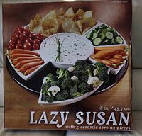Box front photo showing Lazy Susan with snack samples and text indicating 18 inch size and 5 ceramic serving pieces