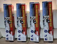 Four boxed sets of BAL Lock-Arm Stabilizing Bars lined up on couch.