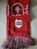 Full view of Toronto FC scarf showing the 2024 member badge and fringed end.