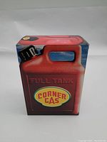 Front view of the red gas canister shaped box with Corner Gas logo and 'Full Tank' text