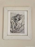 Framed black and white nude sketch print showing full frame and artwork.