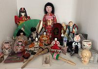 Full collection of Japanese dolls and traditional collectibles displayed together showing variety and size differences.