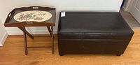 Photo showing both the leather storage bench and the wooden tray table side by side on hardwood floor.